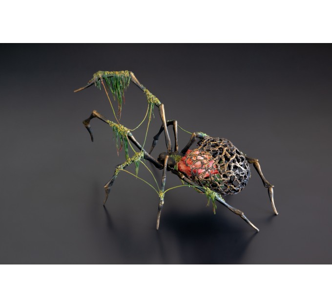 Collectible Handmade black spider sculpture with a rose and moss 