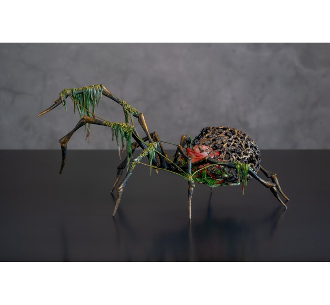 Collectible Handmade black spider sculpture with a rose and moss 