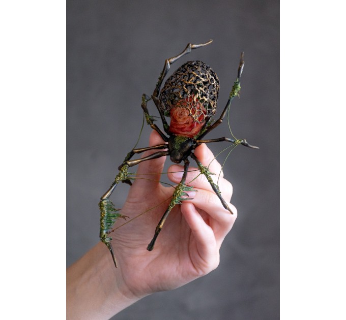 Collectible Handmade black spider sculpture with a rose and moss 