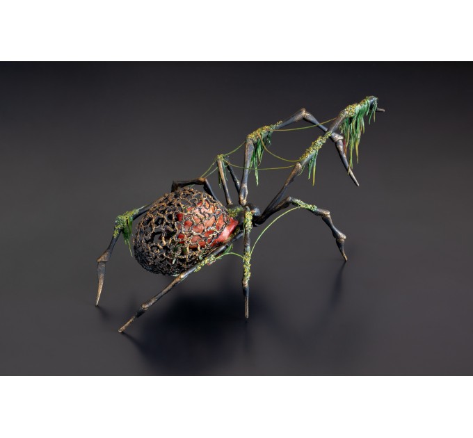 Collectible Handmade black spider sculpture with a rose and moss 