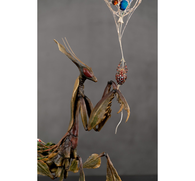 Sculpture of a mantis. Art handmade 