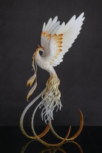 Collectible Phoenix Statue bird made of air clay. White and gold bird