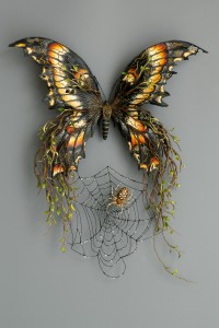 Butterfly with spider sculpture